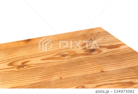 A wooden table corner or tabletop separated from a white background. 134973082
