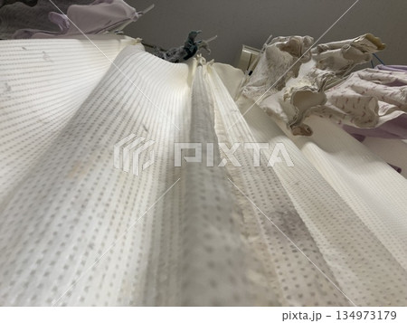 表面まで浮き出たカーテンの黒カビと汚れ 表面まで浮き出たカーテンの黒カビと汚れ 134973179