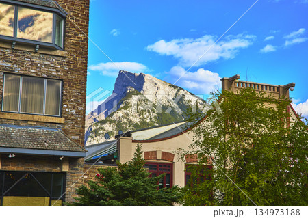 Banff Town Urban Architecture with Majestic Mountain and Lush Trees under Blue Sky Banff Town Urban Architecture with Majestic Mountain and Lush Trees under Blue Sky 134973188