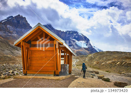 Jasper Mountain Landscape with Wooden Shelter and Hiker Near Athabasca Glacier 134973420