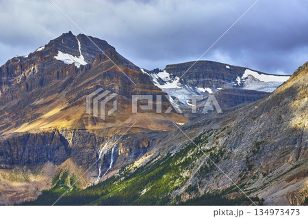 Rocky Mountain Peaks Glacier Waterfall and Forest in Canadian Wilderness Rocky Mountain Peaks Glacier Waterfall and Forest in Canadian Wilderness 134973473