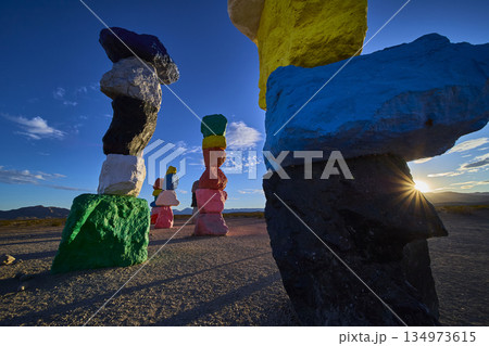 Seven Magic Mountains Colorful Rock Cairn Stacks at Sunset with Sunburst Nevada 134973615