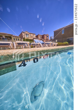 Underwater Pool and Suburban Neighborhood Homes with Sun Loungers in Las Vegas 134973622