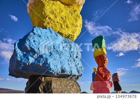 Colorful Rock Cairn Stacks at Seven Magic Mountains Under Blue Sky Nevada 134973678