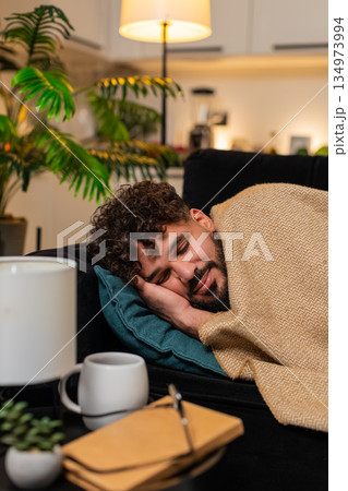 Arabian man exhausted after hard workday lies on pillow closes eyes falls asleep stressed tired late 134973994