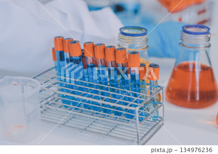 Portrait, science and happy woman on laptop in lab to research chemistry, test or innovation. Microscope, scientist and face of medical doctor in goggles for microbiology, healthcare or pharma study 134976236