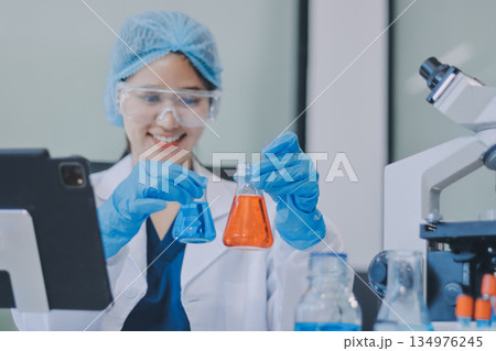 Portrait, science and happy woman on laptop in lab to research chemistry, test or innovation. Microscope, scientist and face of medical doctor in goggles for microbiology, healthcare or pharma study Portrait, science and happy woman on laptop in lab to research chemistry, test or innovation. Microscope, scientist and face of medical doctor in goggles for microbiology, healthcare or pharma study 134976245