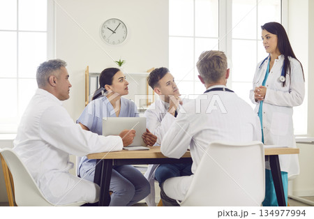 Team Of Doctors And Nurses In Group Meeting At Hospital Team Of Doctors And Nurses In Group Meeting At Hospital 134977994
