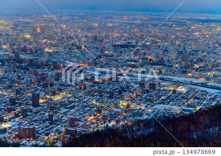 Night view of Sapporo cityscape in winter at twilight from Mt. Moiwa observation, the best city view point, Sapporo, Hokkaido, Japan 134978669