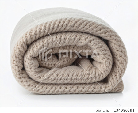 Light natural color. Rolled up comforter. Wool throw blanket on a white background. Minimalist luxury living room. 134980391