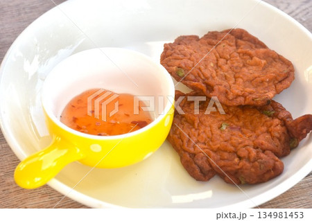 fried fish patty on plate dipping sweet chili sauce fried fish patty on plate dipping sweet chili sauce 134981453