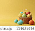 Easter eggs nest yellow background 134981956