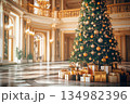 Luxurious Christmas tree and festive decorations in grand hotel lobby 134982396