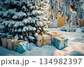 Snowy outdoor Christmas tree with red ornaments and wrapped gifts below 134982397