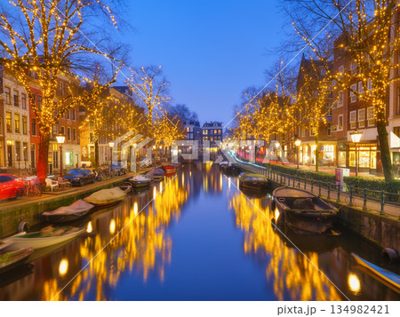 Iconic Amsterdam city landscape during winter holidays with beautiful Christmas decorations 134982421