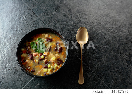Red bean soup with potatoes, tomatoes, paprika, carrot, and bacon. Red bean soup with potatoes, tomatoes, paprika, carrot, and bacon. 134982557