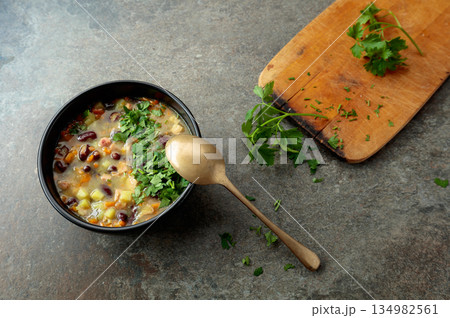 Red bean soup with potatoes, tomatoes, paprika, carrot, and bacon. 134982561