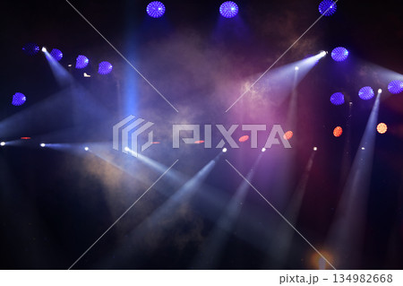 Colorful stage lights create a vibrant atmosphere for a live event at a concert venue Colorful stage lights create a vibrant atmosphere for a live event at a concert venue 134982668