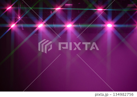 A purple background with lights on it. The lights are in different colors A purple background with lights on it. The lights are in different colors 134982756
