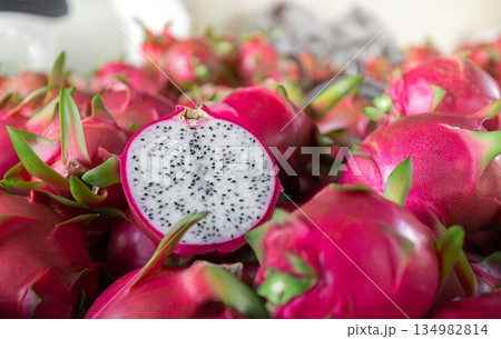Dragon fruit that has been cut in half for product display. dragon fruit which are beautifully arranged in baskets to prepare for export sale. 134982814