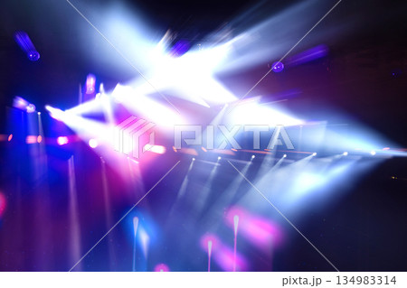 A light show with blue and purple lights. The lights are on a stage 134983314