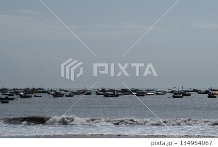 Traditional colorful Vietnamese fishing boats moored on a calm river in Da Nang, Vietnam. 134984067