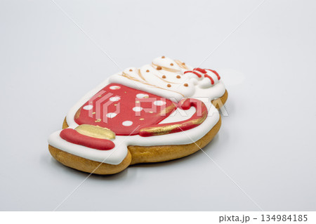 Decorated Christmas cookie shaped like hot chocolate mug closeup. 134984185