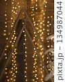 Abstract Christmas background with radiant golden bokeh lights creating a festive, warm holiday decoration concept for banner. 134987044