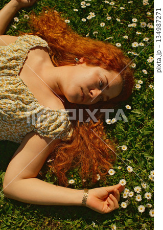 red curly hair beauty girl outdoors at spring season  134987271