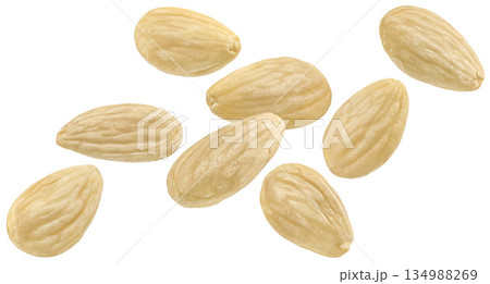Falling peeled almond nuts isolated on white background, full depth of field Falling peeled almond nuts isolated on white background, full depth of field 134988269
