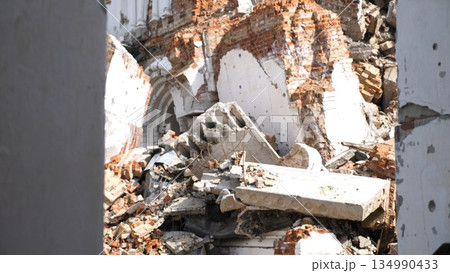 View to destroyed church at Kharkivska oblast. Ruined building after bomb attacks on ukrainian territory from russia army. Consequences of russian invasion of Ukraine. Slow motion 134990433