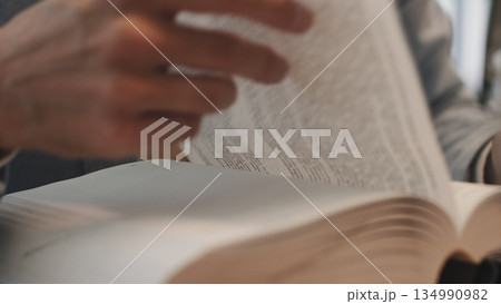 Businessman hands working in stacks of paper files for searching information on work desk office, business report papers,piles of unfinished documents achieves with clips indoor,Business concept. 134990982