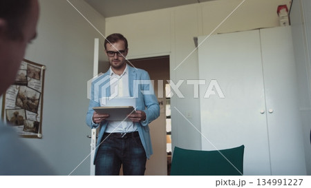 Two successful businessmen wear suits salesman banker manager handshake happy client customer investor at business meeting make bank loan insurance deal agreement shake hands sell 134991227