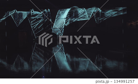 Very beautiful night laser show on the facade of the house. Beautiful laser and musical fountain show. 3D videomapping. Strasbourg, France. 134991257