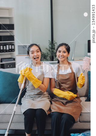 Cleaners clean empty office spaces Cleaners clean empty office spaces 134991433