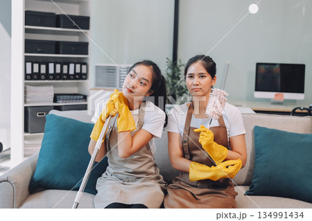 Cleaners clean empty office spaces Cleaners clean empty office spaces 134991434
