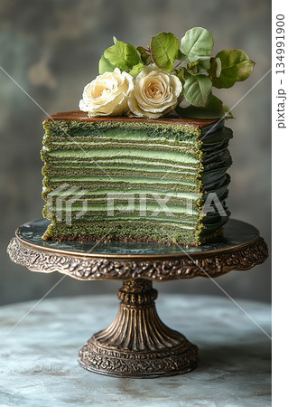 Food image. Japanese matcha mille crepe cake with blossoms. Asian cuisine content. Cultural and global dessert. 134991900