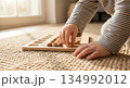 Child Plays With Wooden Plate 134992012