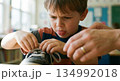 Boy Learning to Tie Shoelaces 134992018