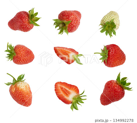 A set of whole and cut strawberries of varying degrees of ripeness on an isolated background A set of whole and cut strawberries of varying degrees of ripeness on an isolated background 134992278