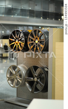 Designer Wheel Rims On The Rack In Automobile Service Center Designer Wheel Rims On The Rack In Automobile Service Center 134993504