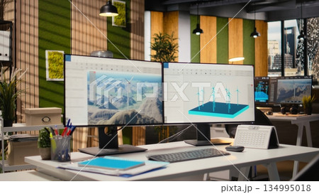 Wind turbine CAD design software used for sustainable energy research in engineering office. Software interface on PC with digital modeling of wind energy generator infrastructure 134995018