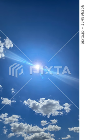 Vast blue sky filled with soft white clouds inspires calm, clarity, and a sense of freedom. Perfect for nature, travel, outdoor, wellness, and inspirational stock imagery. Vast blue sky filled with soft white clouds inspires calm, clarity, and a sense of freedom. Perfect for nature, travel, outdoor, wellness, and inspirational stock imagery. 134996256
