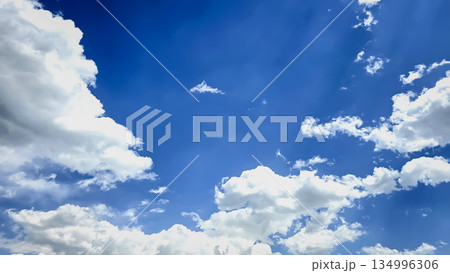 Vast blue sky filled with soft white clouds inspires calm, clarity, and a sense of freedom. Perfect for nature, travel, outdoor, wellness, and inspirational stock imagery. Vast blue sky filled with soft white clouds inspires calm, clarity, and a sense of freedom. Perfect for nature, travel, outdoor, wellness, and inspirational stock imagery. 134996306