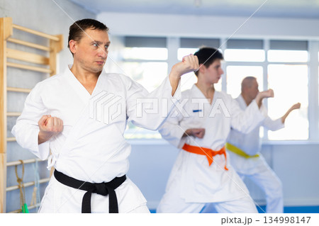 Adult man training karate technique in studio 134998147