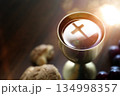 The Holy Communion bread and wine symbolizing the holy blood and body of Jesus Christ, the cross, and the Last Supper background 134998357