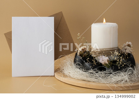 Envelope mockup template Self made egg shell with candle handmade decoration for Easter holiday. Copy space greeting card present gift ideas. Creative reuse zero waste sustainable living eco-friendly 134999002