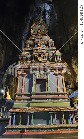 A vibrant Hindu temple bursts with color and sacred detail inside a cave A vibrant Hindu temple bursts with color and sacred detail inside a cave 134999125