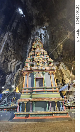 A vibrant Hindu temple bursts with color and sacred detail inside a cave A vibrant Hindu temple bursts with color and sacred detail inside a cave 134999129