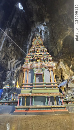 A vibrant Hindu temple bursts with color and sacred detail inside a cave A vibrant Hindu temple bursts with color and sacred detail inside a cave 134999130